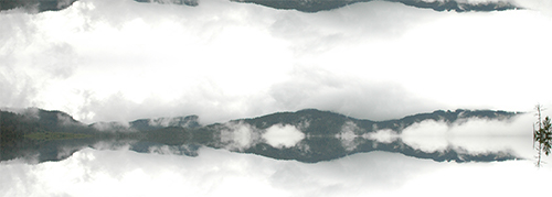 Valokuvateos, jossa pilvien keskellä näkyy vuoriston maisemaa.